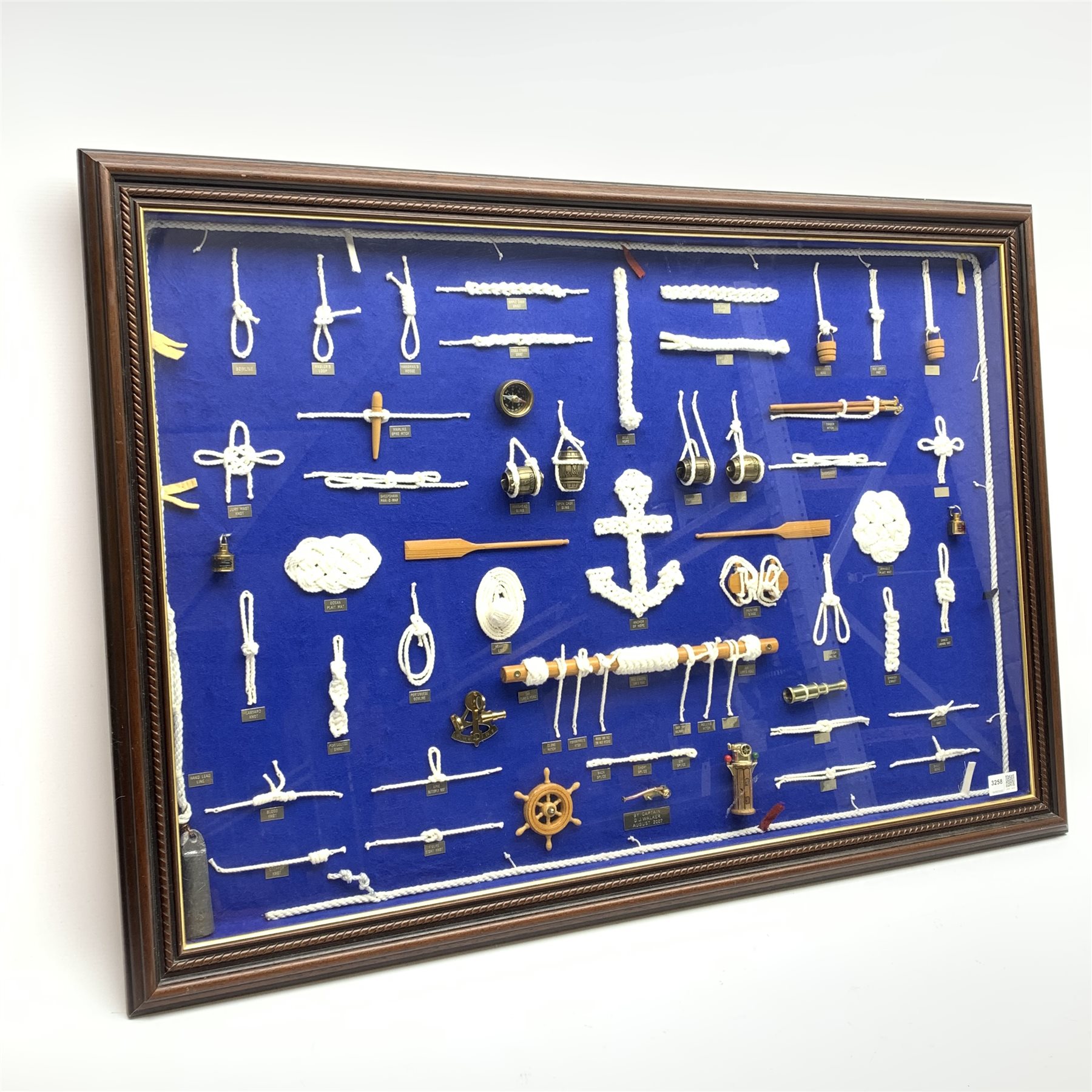 Large framed knot board, including miniature Binnacle, ships wheel and sextant, by Captain D.J.Walk