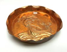 Newlyn School style large circular copper dish, the raised rim with crimped edge and repousse study