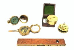 Brass Natural Sine type compass with spirit levels to the dial, bears name of Stanley, D8cm, in earl