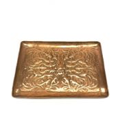 Newlyn School copper tray of rounded oblong form embossed with a shoal of fish swimming amongst bubb