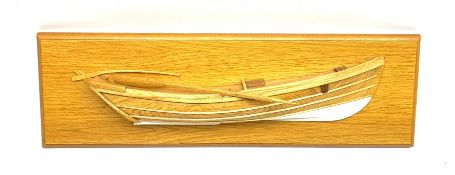 Half block model of a coble made from elm and oak with rudder, loose mounted oar and white painted k