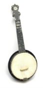 Jolli Joe ukulele by The U.K. Uke Co., made from navy blue painted white metal L55cm