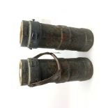 Pair of early 19th century ship's cannon charge carriers, each of ribbed tubular form, made from cor