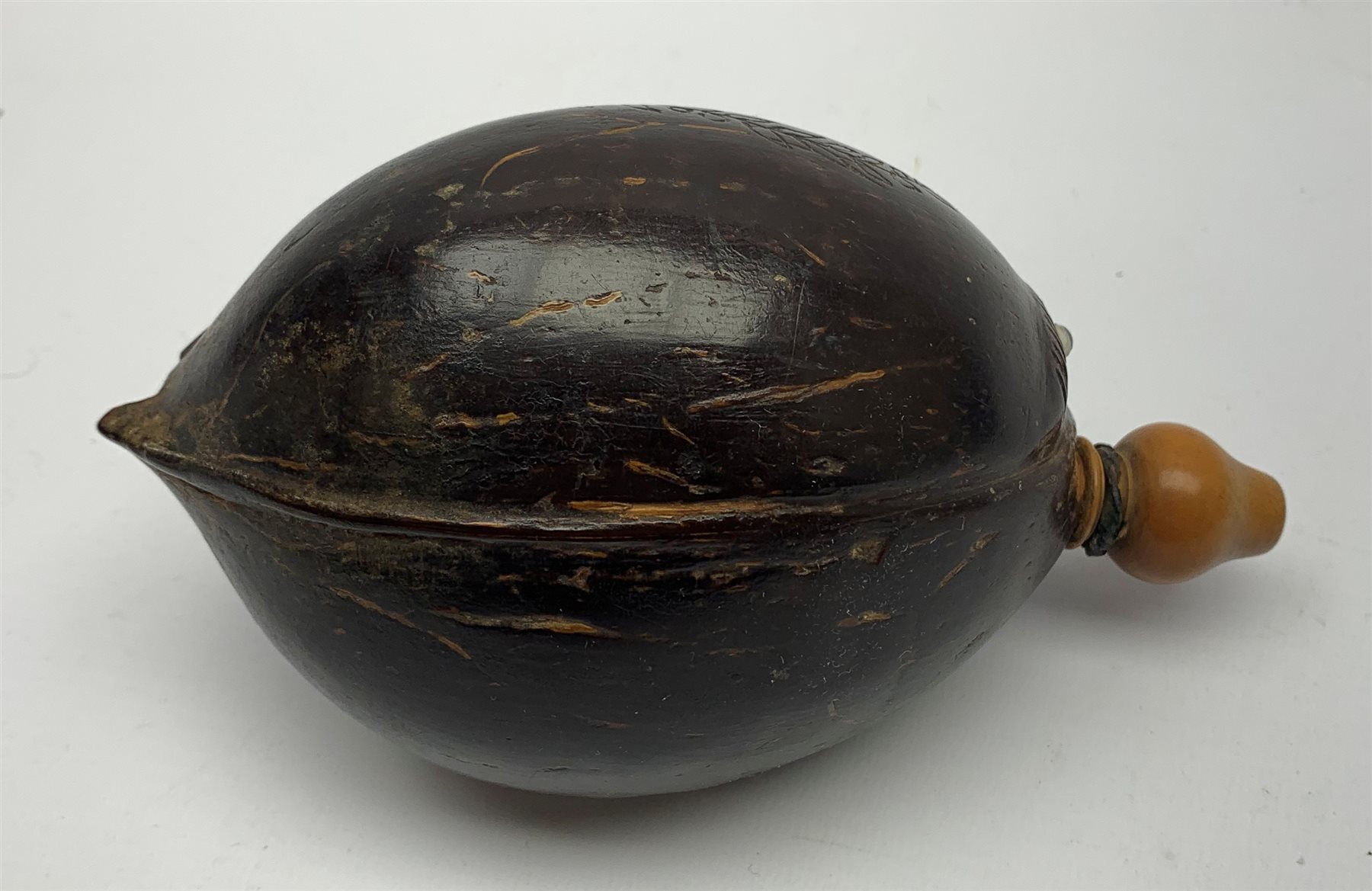 Napoleonic coconut bug bear flask with carved decoration and initials, inset glass eyes and turned b - Image 3 of 6