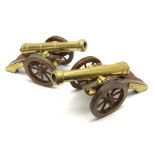 Large pair of 20th century brass model cannons, each on brass mounted mahogany carriage with coopere