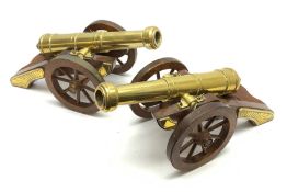 Large pair of 20th century brass model cannons, each on brass mounted mahogany carriage with coopere