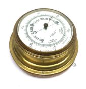 20th century brass bulkhead barometer by John Barker & Co.Ltd Kensington, on oak backboard, D23cm