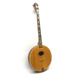 Four-string banjo guitar with mahogany circular back and sides and spruce top, mother-of-pearl inlai