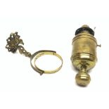 Ship's bulkhead mounting brass oil lamp of drum shaped form, gimbal mounted on dolphin shaped bracke