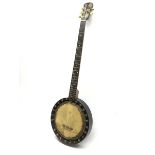 Early 20th century five-string banjo with ebonised frame and walnut neck, the headstock with engrave