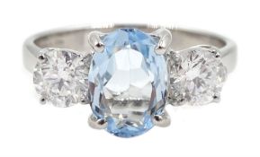 18ct white gold oval aquamarine and round brilliant cut diamond, three stone ring, hallmarked, aquam
