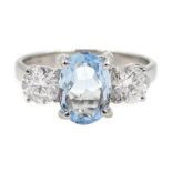 18ct white gold oval aquamarine and round brilliant cut diamond, three stone ring, hallmarked, aquam