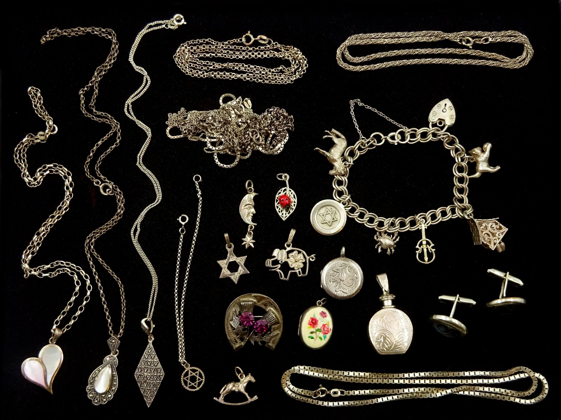 Silver necklaces, silver stone set pendants and charm bracelet, all stamped or tested