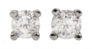 Pair of 18ct white gold single stone diamond stud earrings, stamped 750, diamond total weight 0.40 c