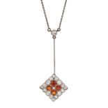 Early 20th century 18ct white gold, milgrain set old cut diamond and orange garnet pendant, on silve