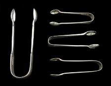 William IV silver sugar tongs by William Eaton, London 1837 and three smaller Victorian and later si