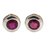 Pair of silver and 14ct gold wire ruby stud earrings, stamped 925