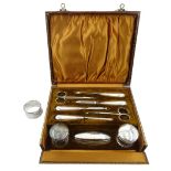 Silver mounted manicure set by Samuel M Levi, Birmingham 1925, in velvet lined case and a silver nap