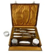 Silver mounted manicure set by Samuel M Levi, Birmingham 1925, in velvet lined case and a silver nap