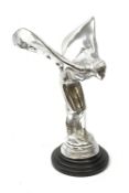 A cast Rolls Royce Spirit of Ecstasy car mascot, raised upon a circular stepped wooden base, H36cm.