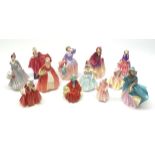 A group of twelve Royal Doulton figurines, comprising Midinette HN2090, Delphine HN2136, Delight HN1