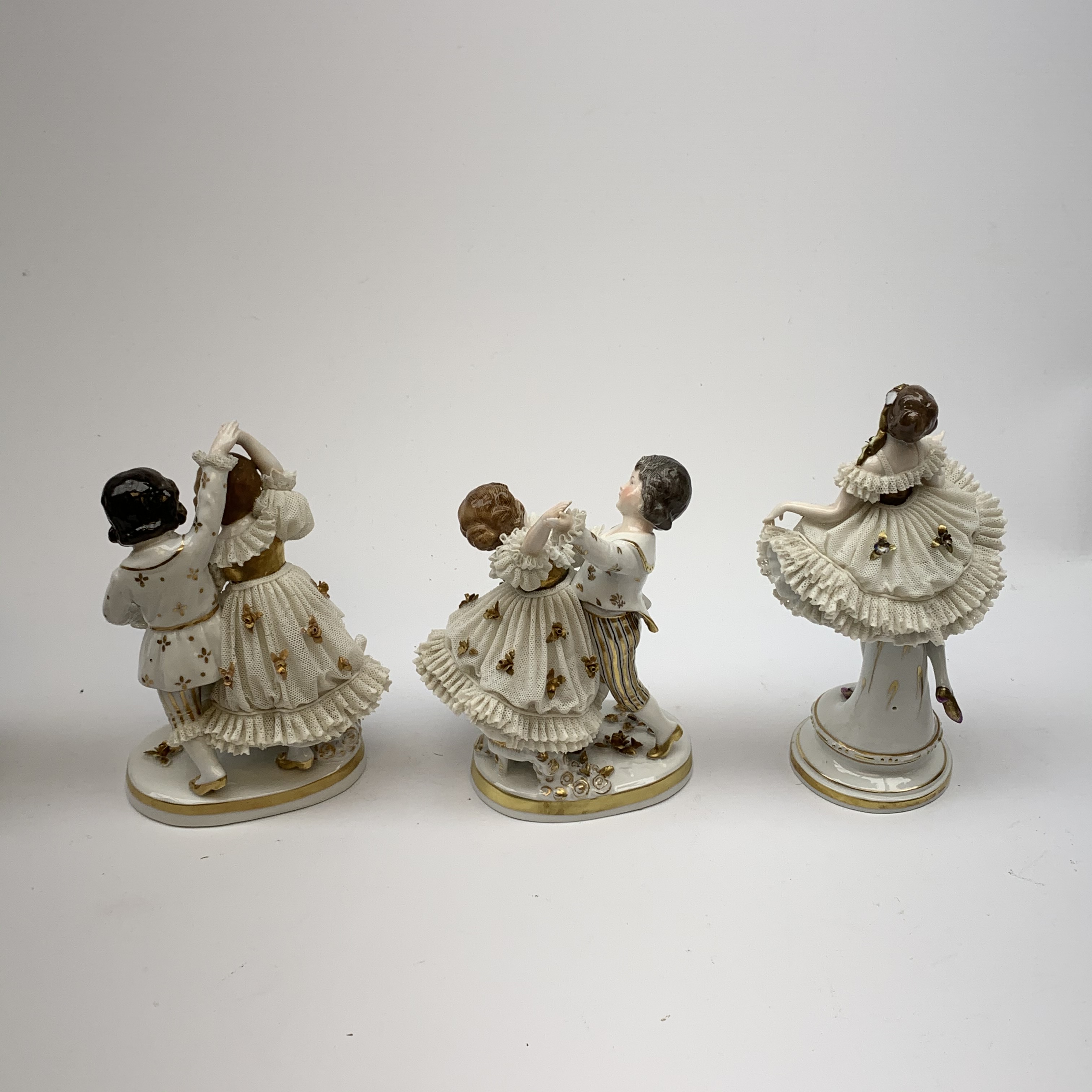 A 20th century Sitzendorf porcelain figurine, modelled in lace dress detailed with gilt flowers and - Image 5 of 8