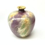 An A J Wilkinson Oriflamme vase designed by John Butler, of ovoid form with lustre marbled decoratio