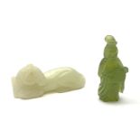 A Chinese celadon jade carved figure, modelled as a recumbent horse, L6cm, together with a nephite j