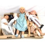 A group of assorted plastic, celluloid and porcelain headed dolls.