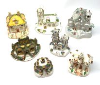 A collection of 19th century and later Staffordshire buildings and pastille burners, together with a