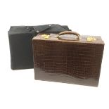 An early 20th century brown Alligator leather vanity suitcase, detailed with gilt tooled initials, t