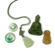 A jade pendant modelled as a hotai, H3.5cm, two small jade pi discs, a further carved pendant modell