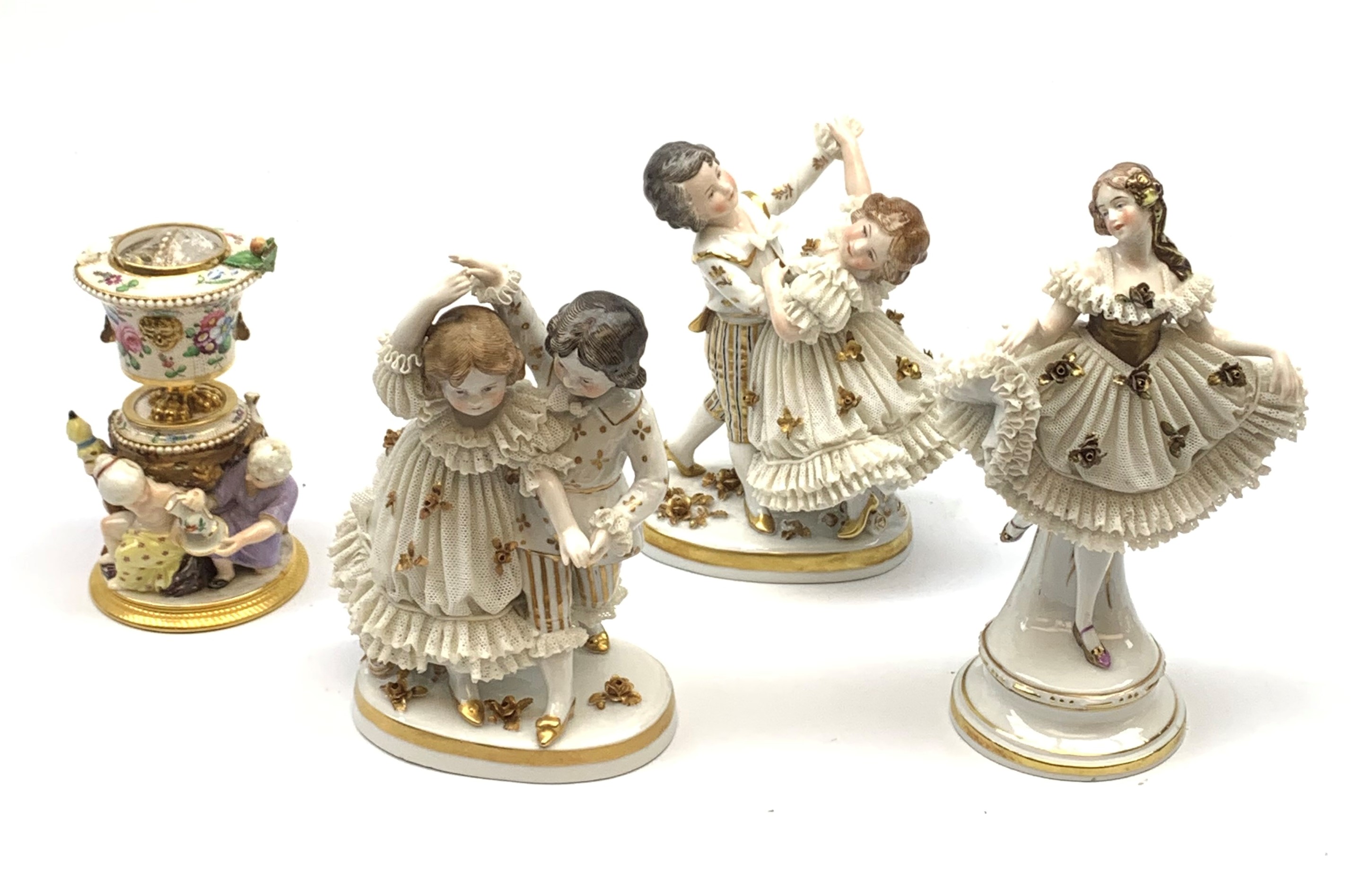 A 20th century Sitzendorf porcelain figurine, modelled in lace dress detailed with gilt flowers and