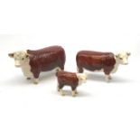 A Beswick Hereford Bull, Hereford Cow, and Hereford Calf, each with printed mark beneath, Bull and C