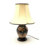 A Moorcroft Oberon pattern lamp, designed by Rachel Bishop, of baluster form and raised upon a circu