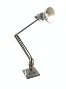 A black Hebert Terry Anglepoise lamp, on square stepped base, marked.