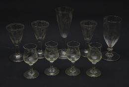 A group of nine Edwardian drinking glasses, a number with etched decoration, largest H15cm.