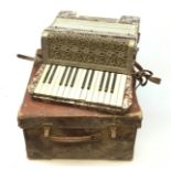 A cased Alvari piano accordion.