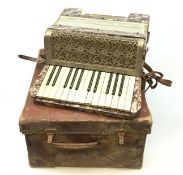 A cased Alvari piano accordion.