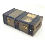 A Vintage travelling trunk with labels to the hinged opening cover, L91cm.