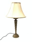 A bronzed table lamp, with tapering twist stem and fabric shade, including shade H70cm.