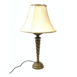 A bronzed table lamp, with tapering twist stem and fabric shade, including shade H70cm.