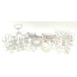 A collection of clear glass, comprising thirty two various drinking glasses, some with engraved foli