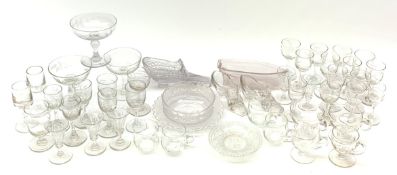 A collection of clear glass, comprising thirty two various drinking glasses, some with engraved foli