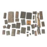 A collection of various Vintage woodblock letter stamps.