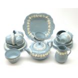 A Wedgwood Queensware tea service, comprising teapot, milk jug, open sucrier, eight teacups, six sau