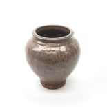 A Japanese vase, of squat ovoid form with merging purple ground, with incised character mark beneath