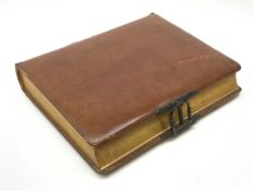 A Victorian leather bound photograph album, the majority of leaves with printed botanical detail, H2