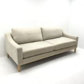 Three seat Noble & Jones sofa, upholstered in a beige fabric, square tapering supports (W224cm) and