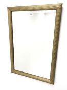 Gilt framed bevel edged wall mirror with oval centre , W93cm, H68cm